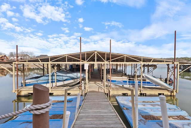 view of dock featuring a water view and boat lift