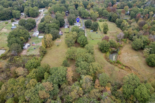 drone / aerial view featuring a view of trees