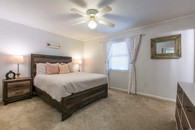 bedroom featuring light colored carpet, crown molding, a textured ceiling, and baseboards