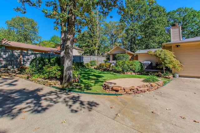 view of yard with a patio and fence