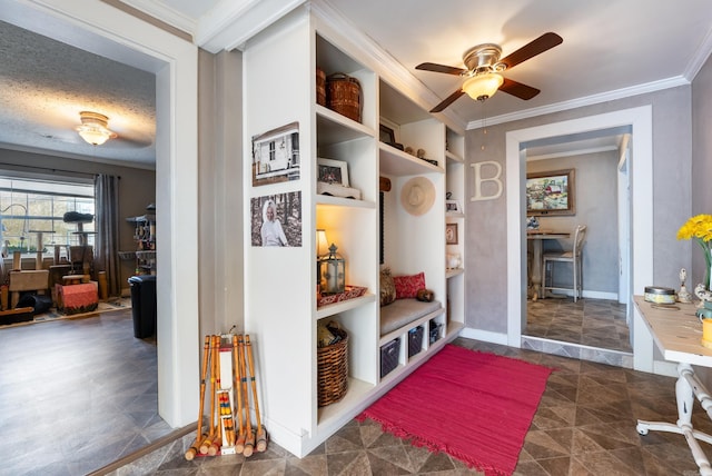 mudroom featuring crown molding, a textured ceiling, baseboards, and ceiling fan