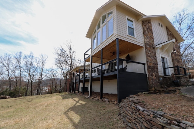 view of home's exterior featuring cooling unit and a yard