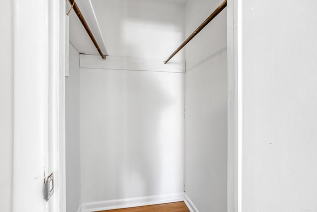 spacious closet featuring wood finished floors