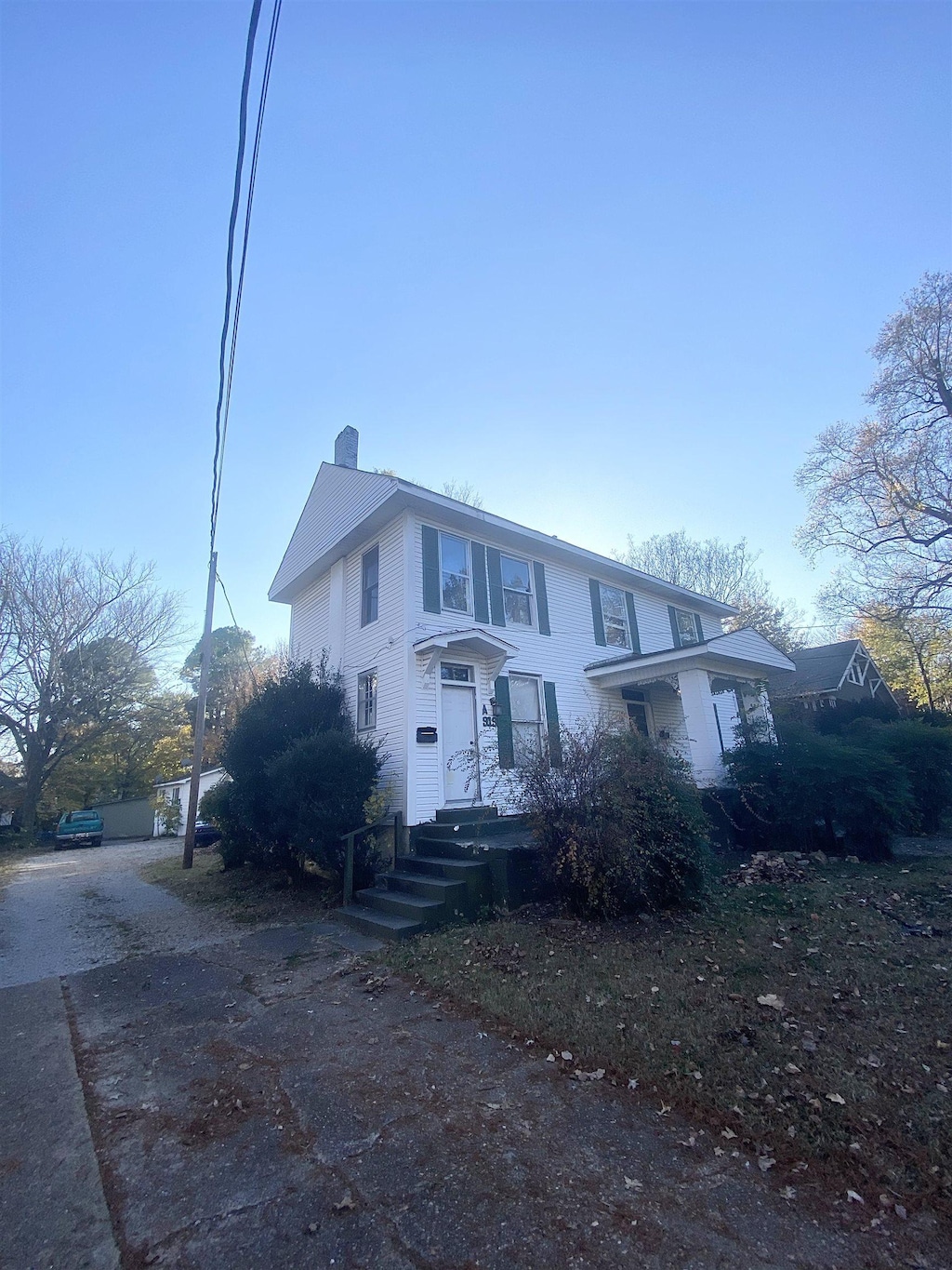 view of front of home featuring a chimney