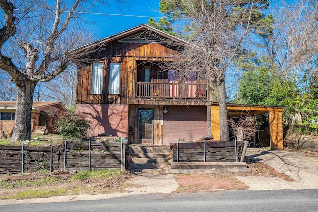 rustic home featuring a balcony