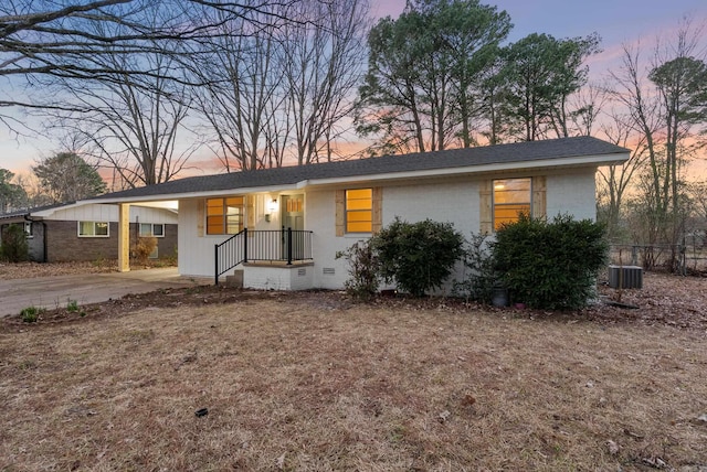 ranch-style home featuring crawl space, central air condition unit, fence, and a shingled roof