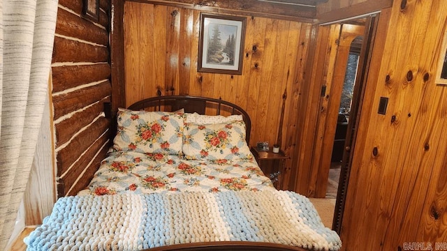 bedroom featuring wooden walls
