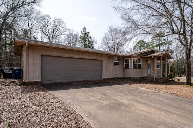 ranch-style home featuring driveway and an attached garage