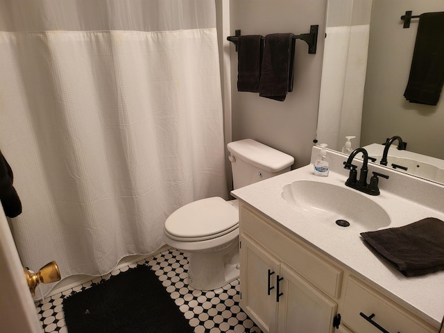 bathroom with vanity, toilet, and a shower with curtain