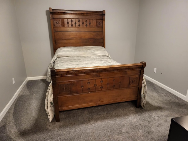 bedroom with carpet flooring and baseboards