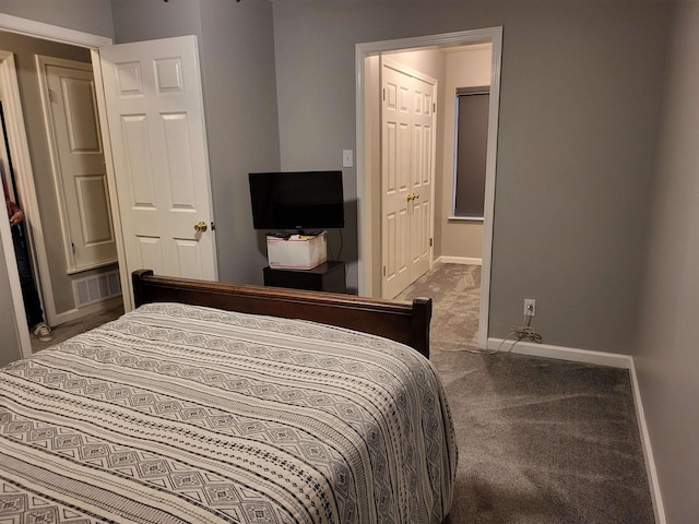 bedroom featuring carpet floors, visible vents, and baseboards