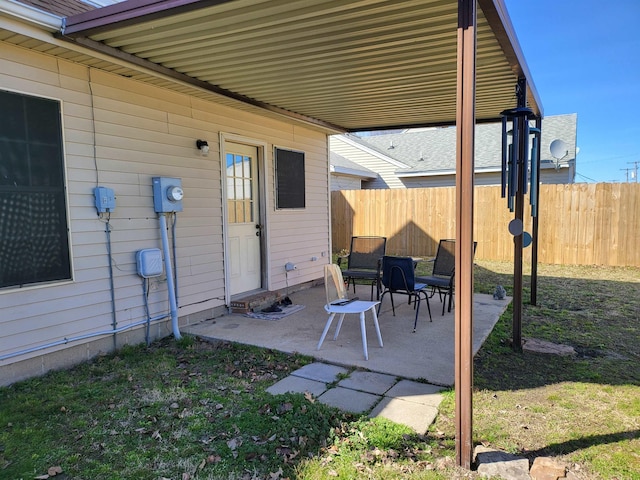 view of patio featuring fence