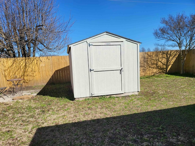 view of shed featuring a fenced backyard