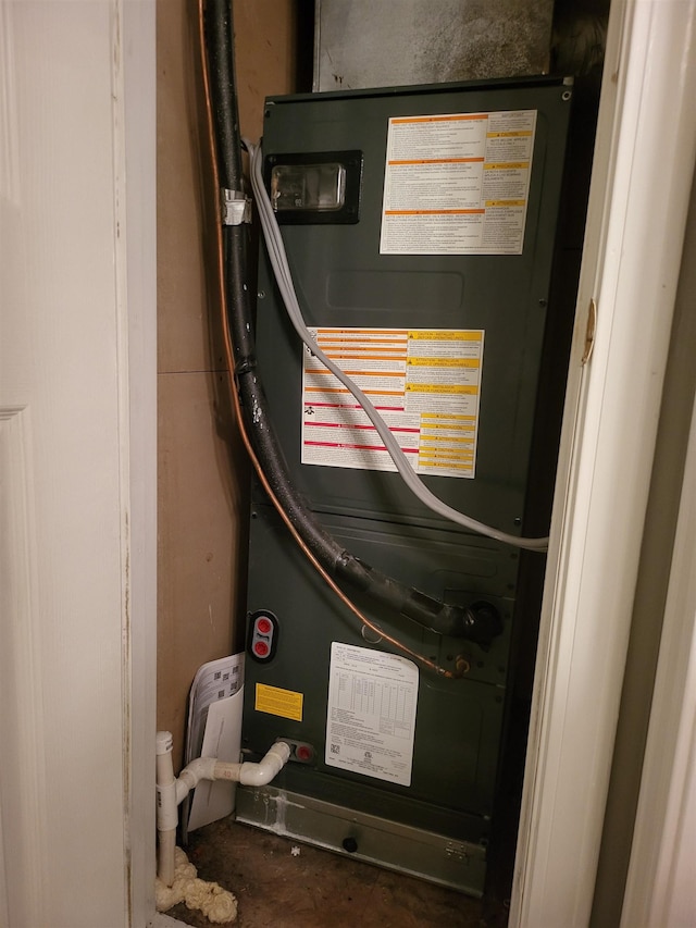 utility room with heating unit