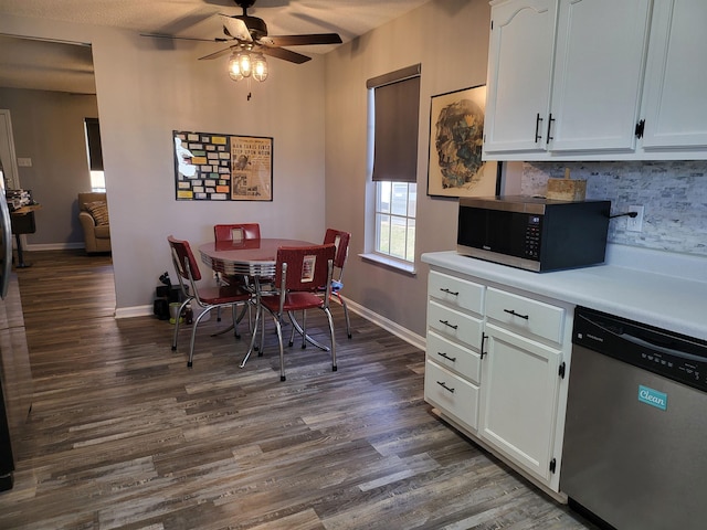 dining area with a ceiling fan, dark wood finished floors, and baseboards