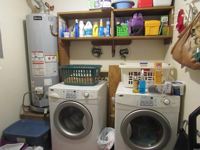 laundry area featuring gas water heater, laundry area, and washing machine and clothes dryer