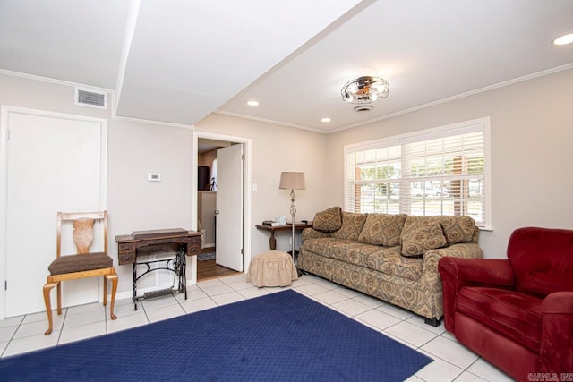 living area featuring visible vents, ornamental molding, and light tile patterned flooring