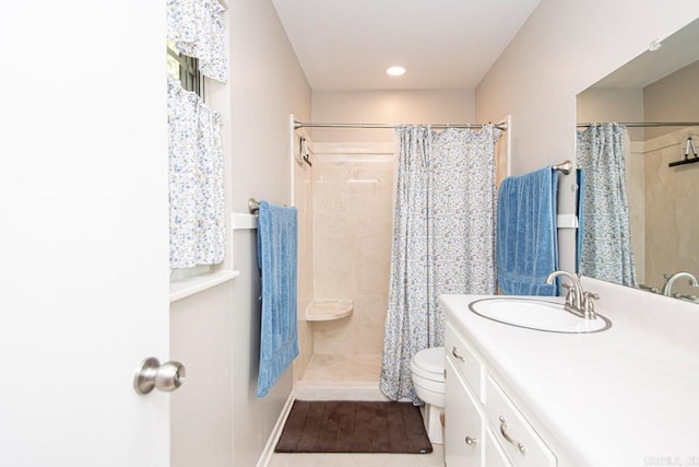 bathroom with toilet, tile patterned flooring, vanity, and a shower with shower curtain