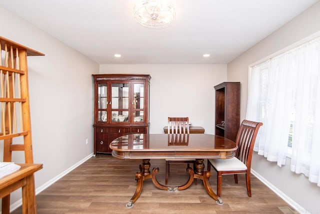 dining room featuring recessed lighting, baseboards, and wood finished floors