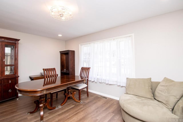 dining space featuring recessed lighting, wood finished floors, visible vents, and baseboards