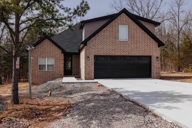 traditional home featuring a garage, driveway, brick siding, and roof with shingles