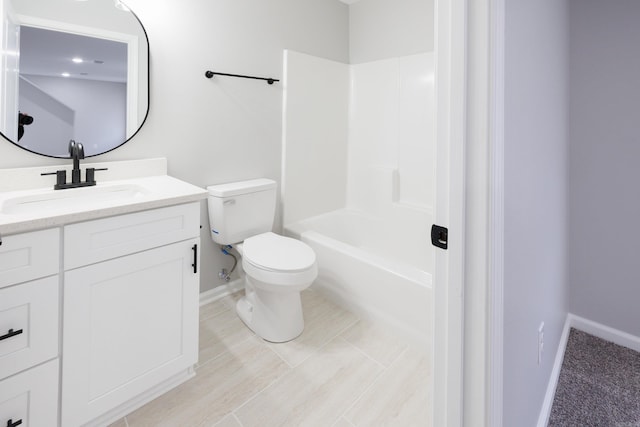 full bath featuring shower / bathing tub combination, vanity, toilet, and baseboards