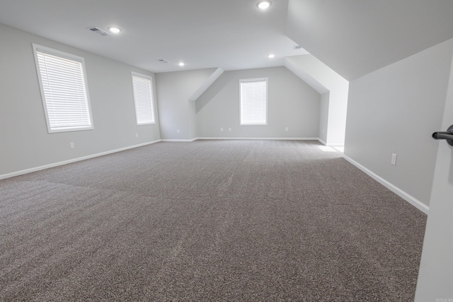 bonus room with recessed lighting, carpet flooring, visible vents, baseboards, and vaulted ceiling