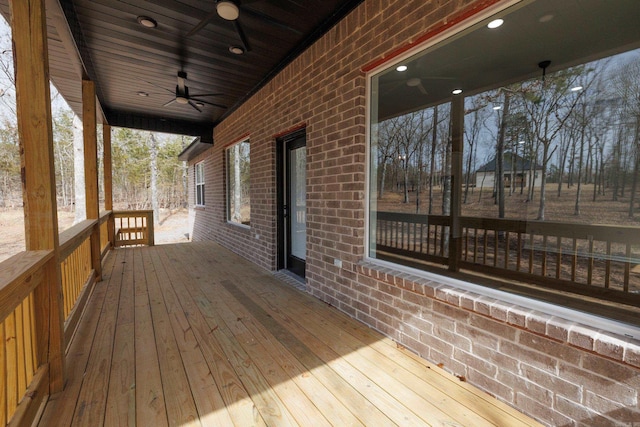 wooden terrace featuring a ceiling fan