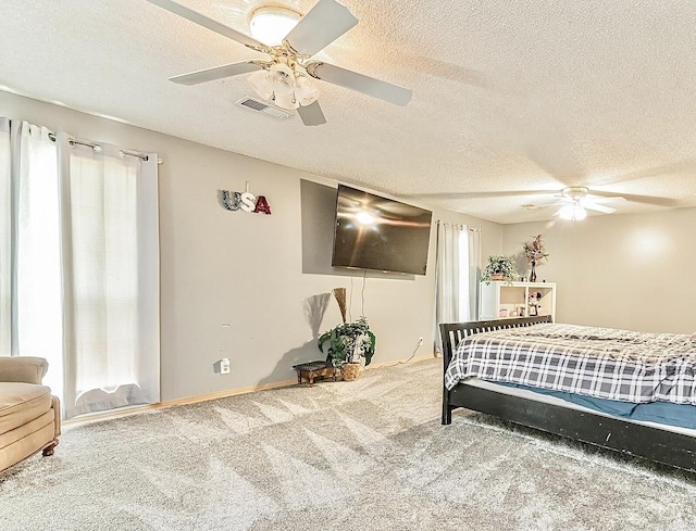 carpeted bedroom with visible vents, ceiling fan, and multiple windows