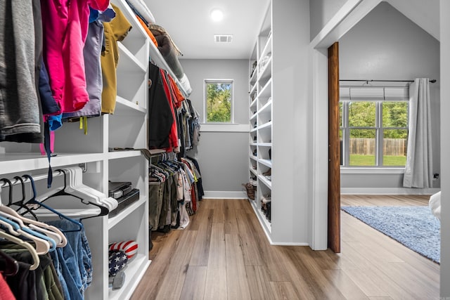 spacious closet with visible vents and wood finished floors