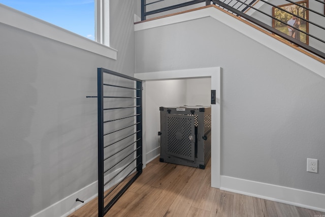 interior space featuring baseboards and wood finished floors