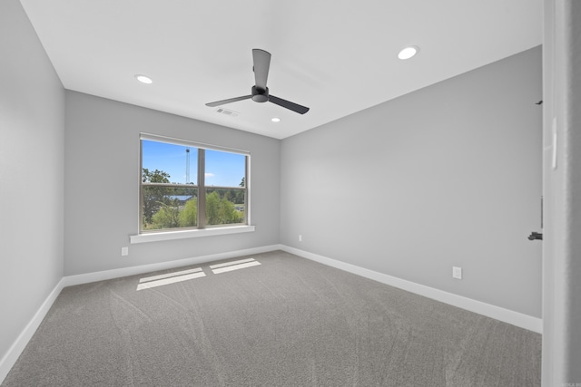 empty room with carpet, ceiling fan, baseboards, and recessed lighting