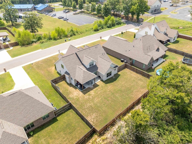 birds eye view of property with a residential view