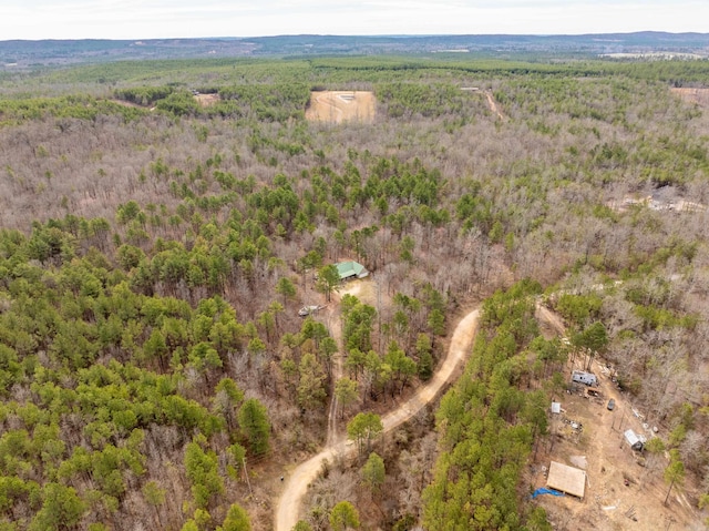 birds eye view of property with a wooded view