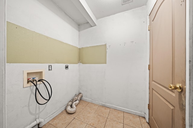 washroom featuring laundry area, hookup for a washing machine, hookup for an electric dryer, and light tile patterned flooring