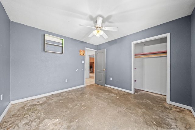 unfurnished bedroom featuring a closet, ceiling fan, baseboards, and unfinished concrete floors