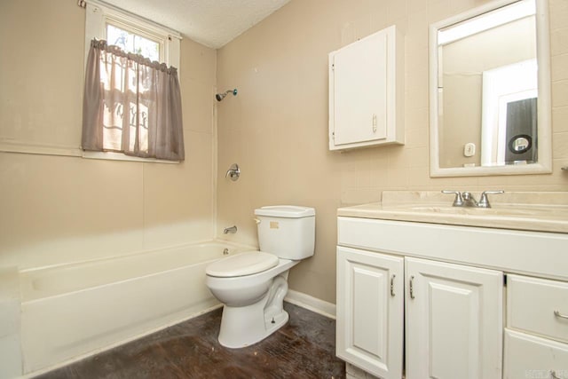 full bathroom with baseboards, toilet, tub / shower combination, a textured ceiling, and vanity