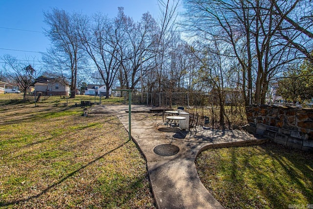 view of yard with fence and a patio