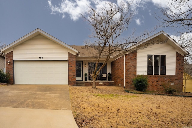 ranch-style house featuring brick siding, driveway, and an attached garage