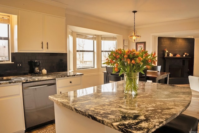 kitchen with ornamental molding, white cabinetry, dishwasher, and backsplash