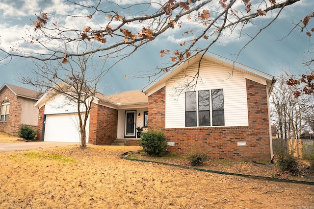 ranch-style house with a garage, crawl space, brick siding, and concrete driveway