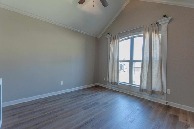 unfurnished room with baseboards, a ceiling fan, dark wood-style floors, ornamental molding, and vaulted ceiling
