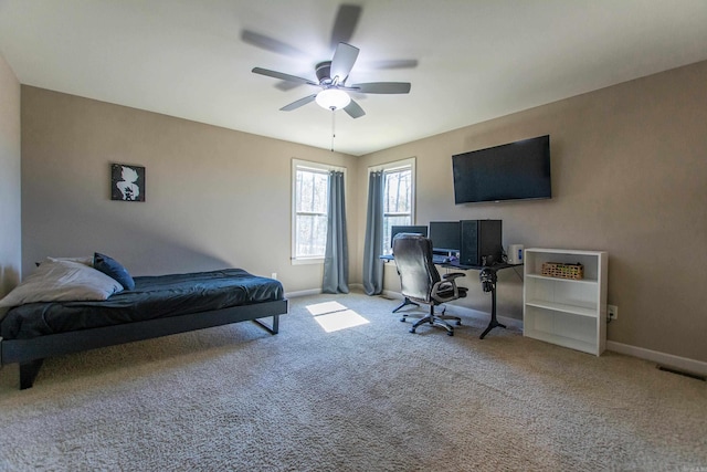 carpeted bedroom with visible vents, ceiling fan, and baseboards