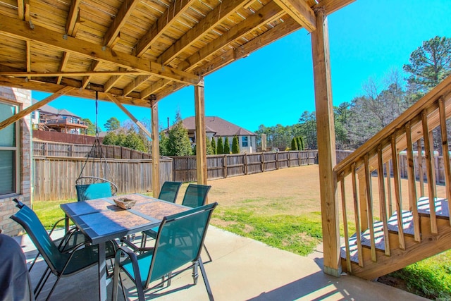 view of patio / terrace featuring outdoor dining area and a fenced backyard