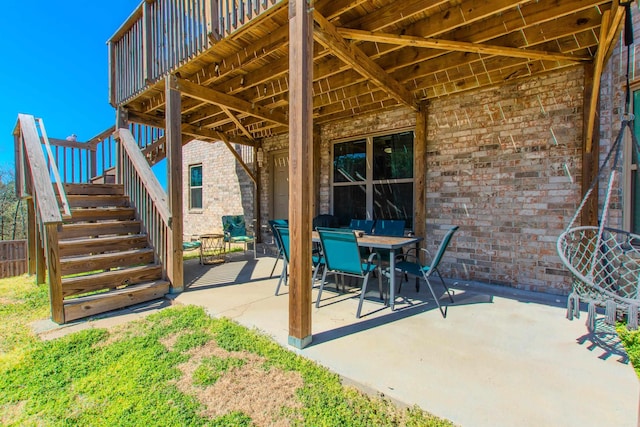 view of patio / terrace with outdoor dining space and stairway