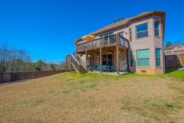 back of property with a yard, stairway, a patio area, and a fenced backyard