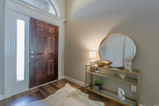 entryway with plenty of natural light, baseboards, and wood finished floors