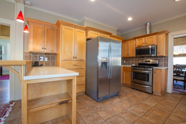 kitchen with pendant lighting, crown molding, tasteful backsplash, light countertops, and appliances with stainless steel finishes