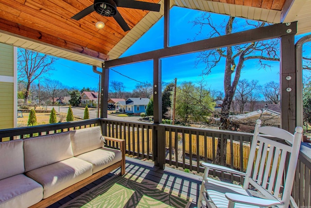 deck featuring a residential view, ceiling fan, and an outdoor living space