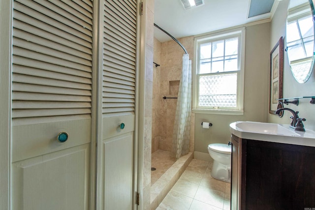 bathroom featuring a closet, vanity, toilet, and a stall shower